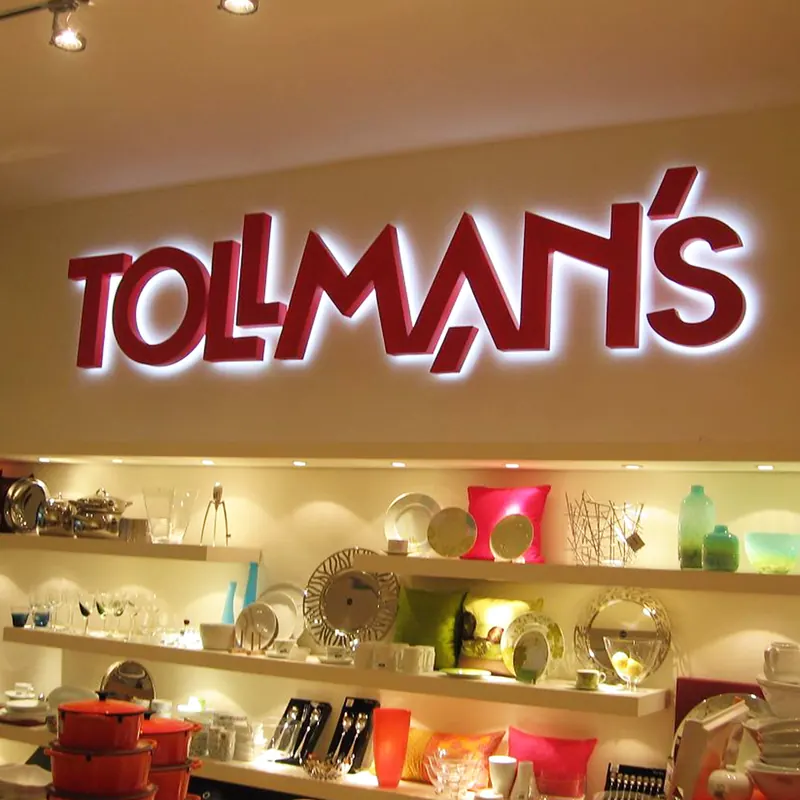 שילוט חזית ופנים בחנות Tollmans — עבודה של אדם שלטים — תמונה 8